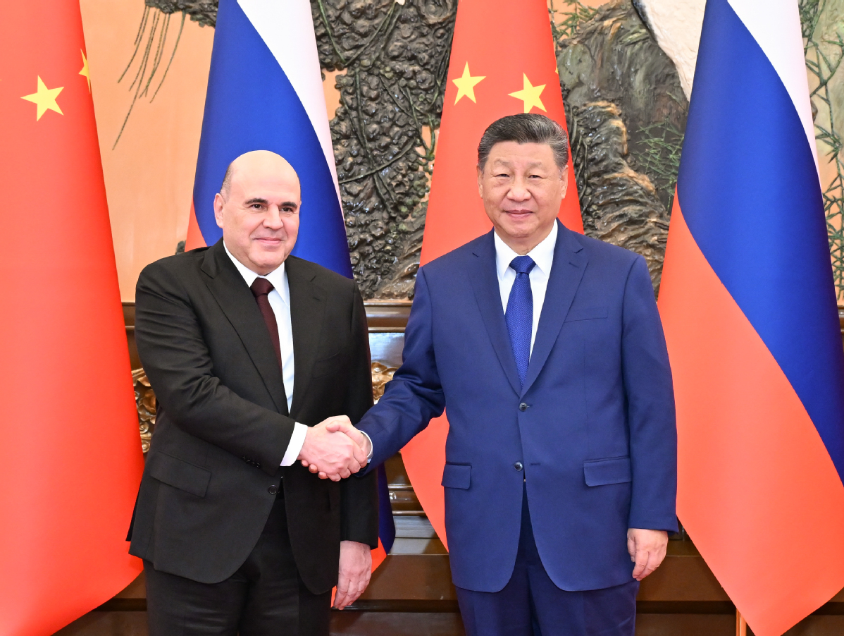 Xi meets Russian PM in Beijing