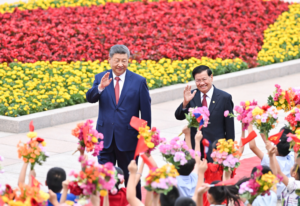 Chinese, Lao top leaders hold talks in Beijing