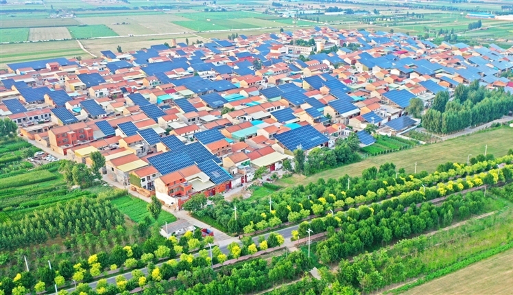 Solar panels shine over resettlement community