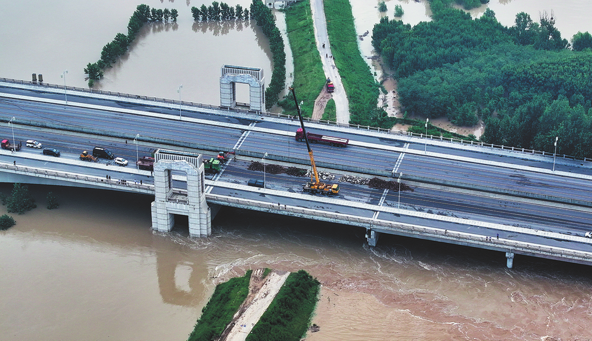 Multiple levee breaches hit Henan after typhoon rains
